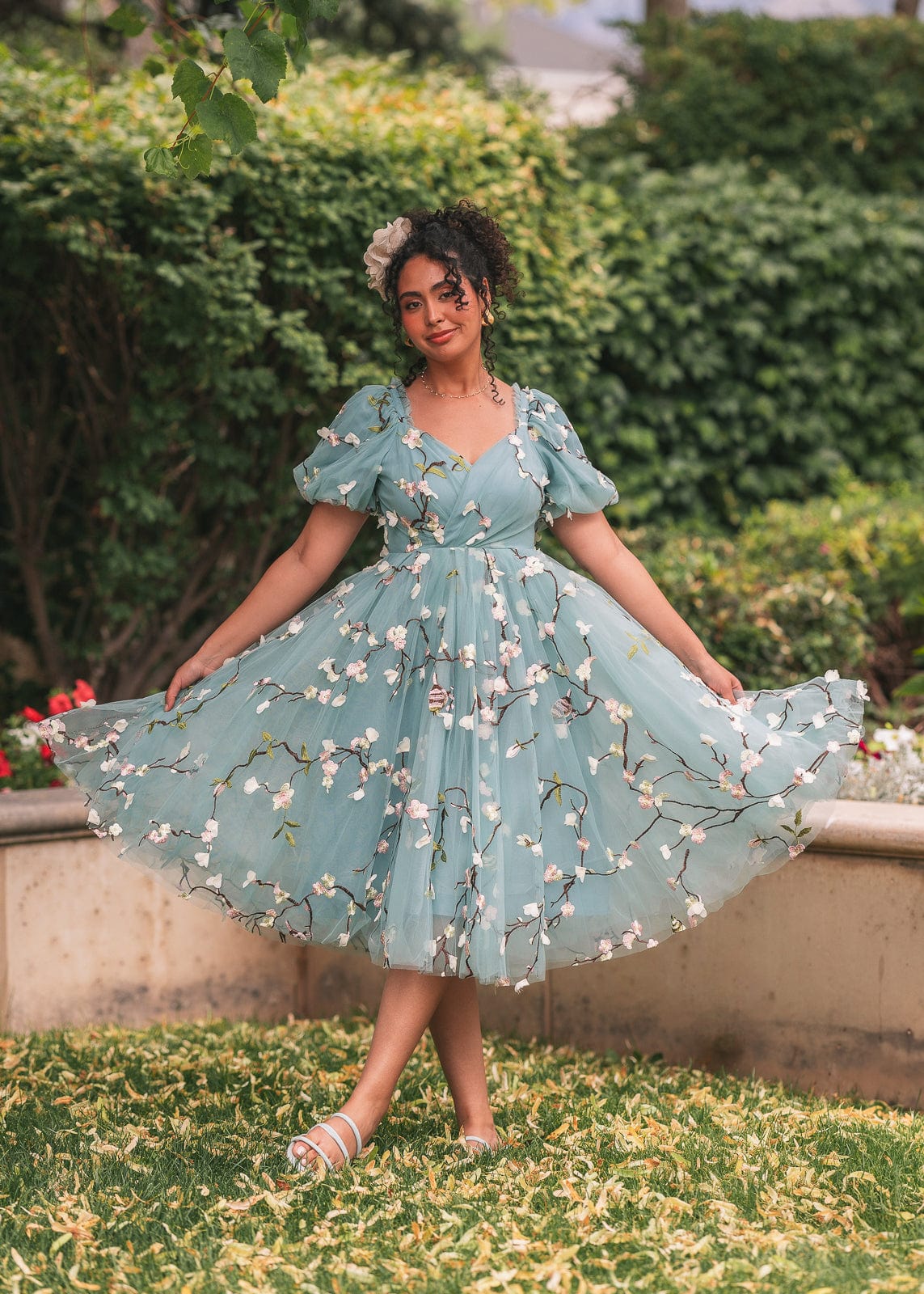 chic size inclusive model wearing JessaKae Almond Blossom Dress