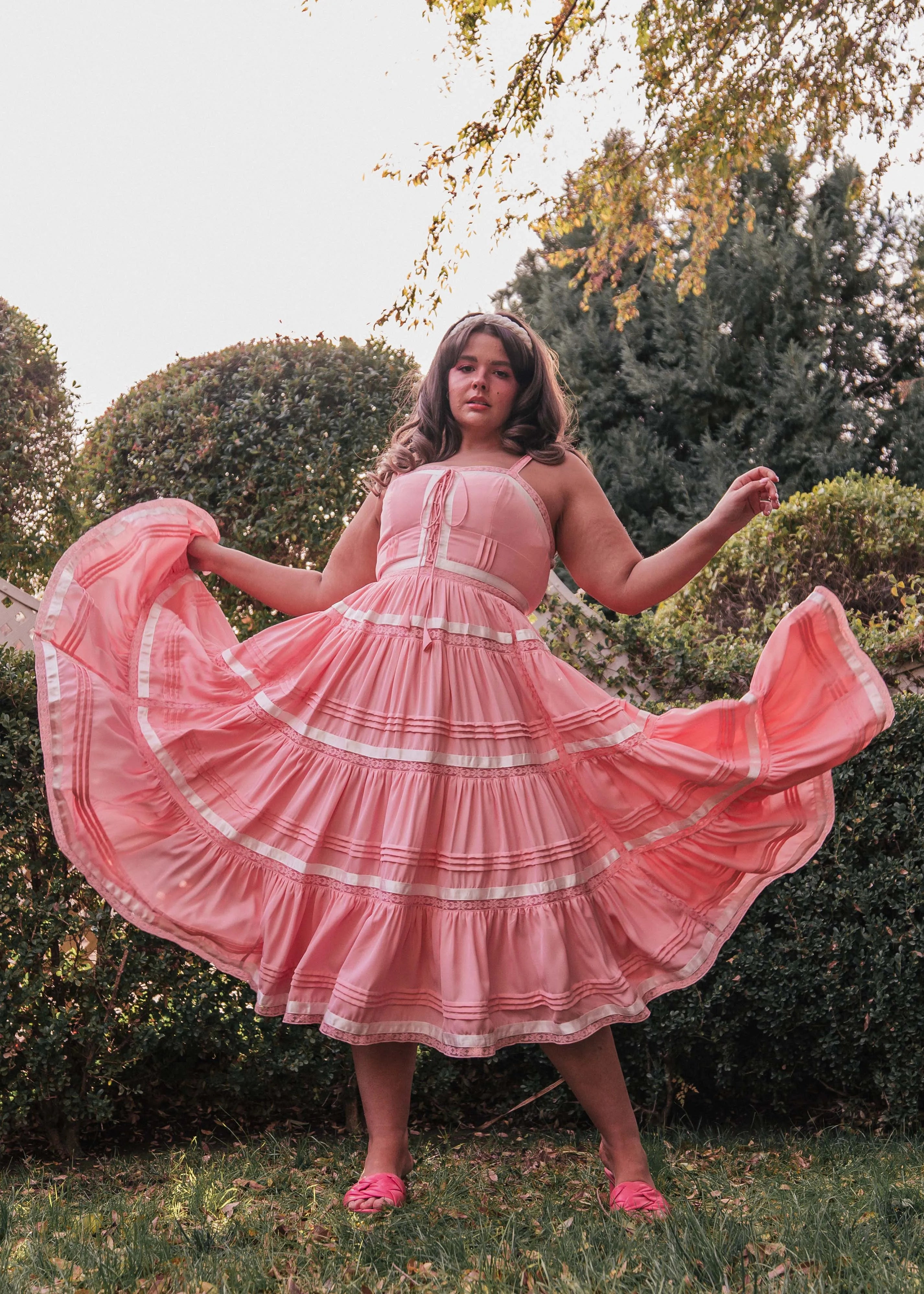 chic size inclusive model wearing JessaKae Delores Dress in Pink Dresses