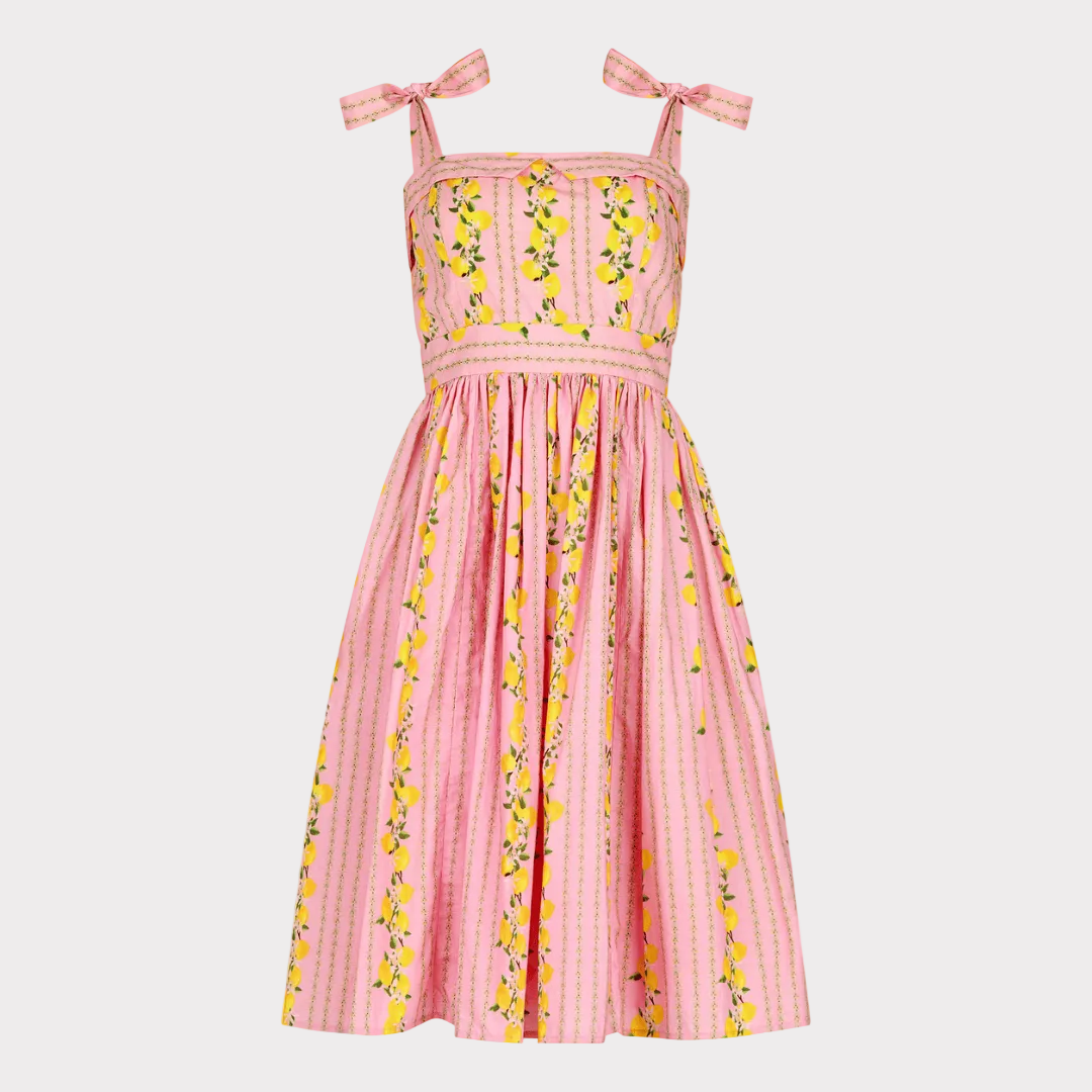 chic size inclusive model wearing JessaKae Lemon Drop Dress