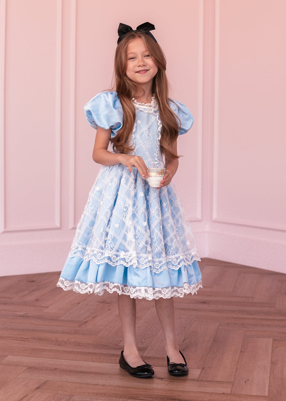 chic size inclusive model wearing JessaKae Wonderland Girls Dress