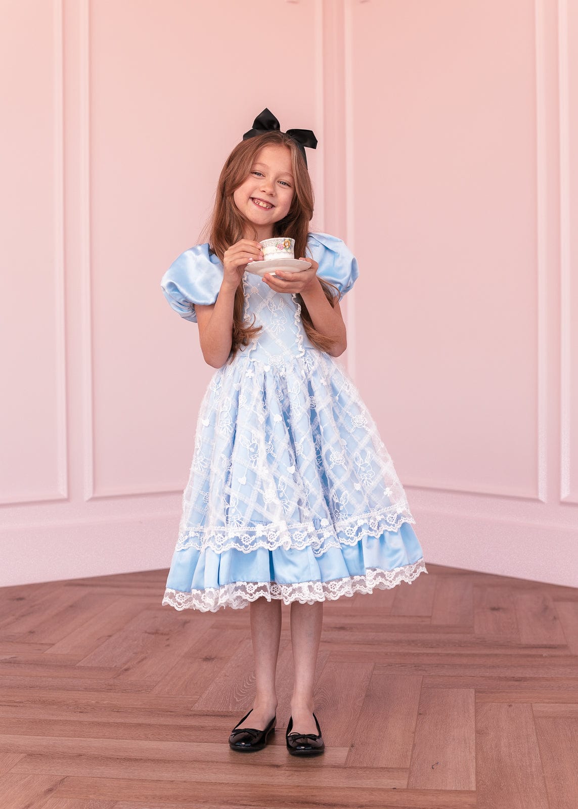 chic size inclusive model wearing JessaKae Wonderland Girls Dress