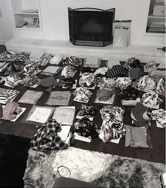 Dresses folded and laid out across a table