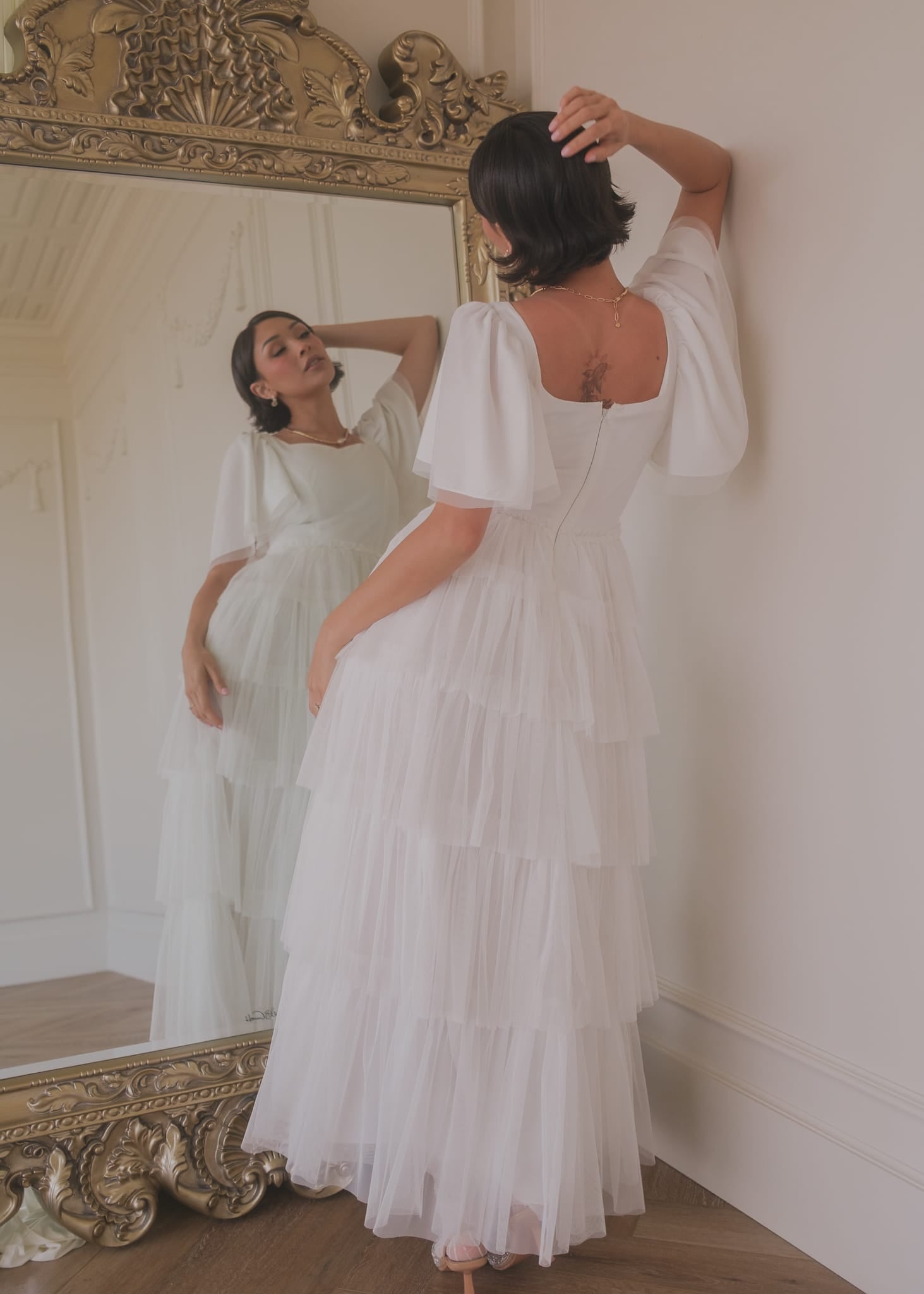 chic size inclusive model wearing JessaKae Allegro Dress White Dresses