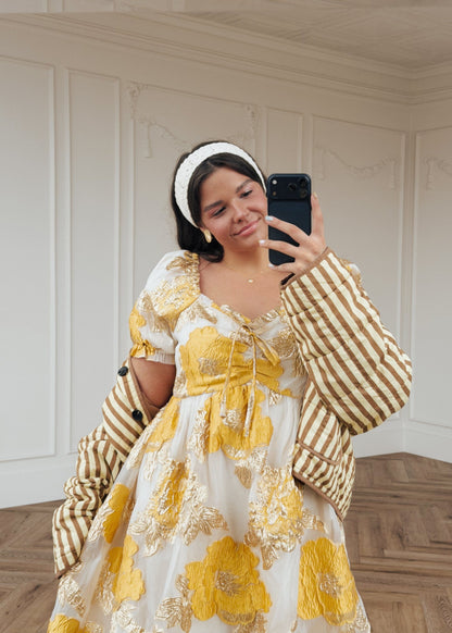 chic size inclusive model wearing JessaKae Beaumont Cream Gold Dress Dresses