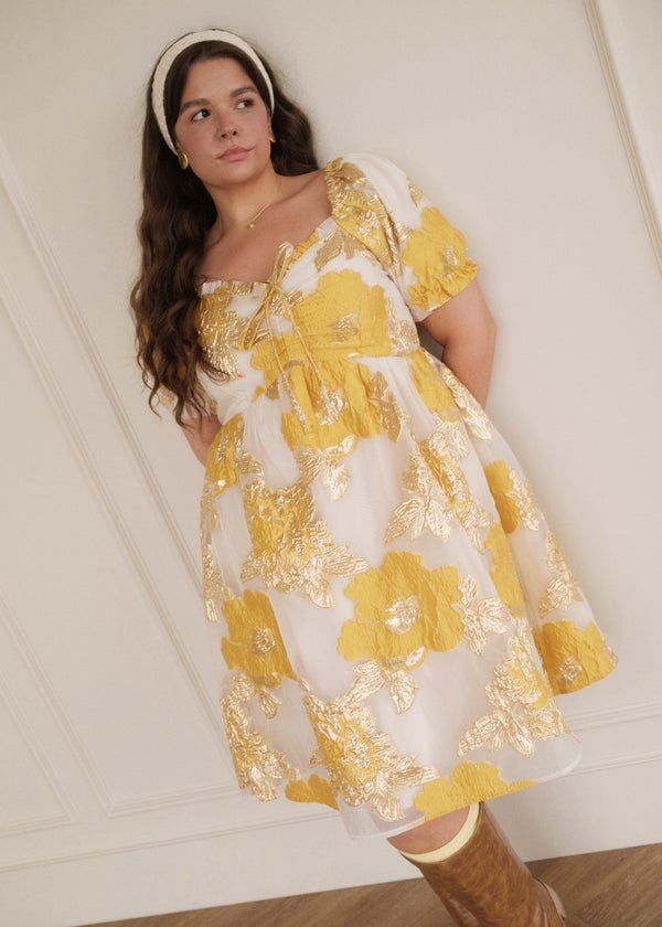 chic size inclusive model wearing JessaKae Beaumont Cream Gold Dress Dresses