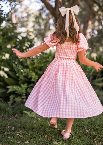 chic size inclusive model wearing JessaKae Bonnet Girls Dress