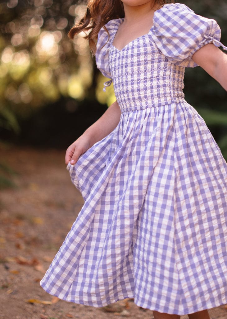 chic size inclusive model wearing JessaKae Bonnet Girls Dress