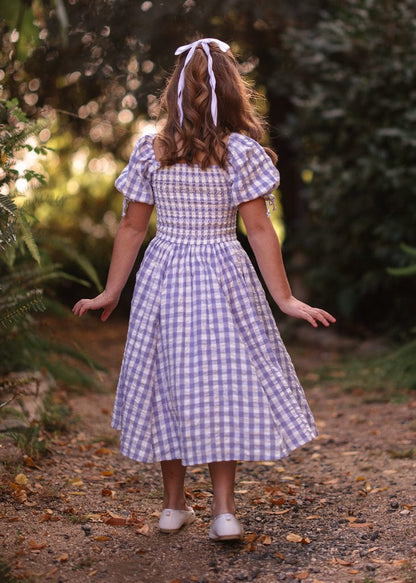 chic size inclusive model wearing JessaKae Bonnet Girls Dress