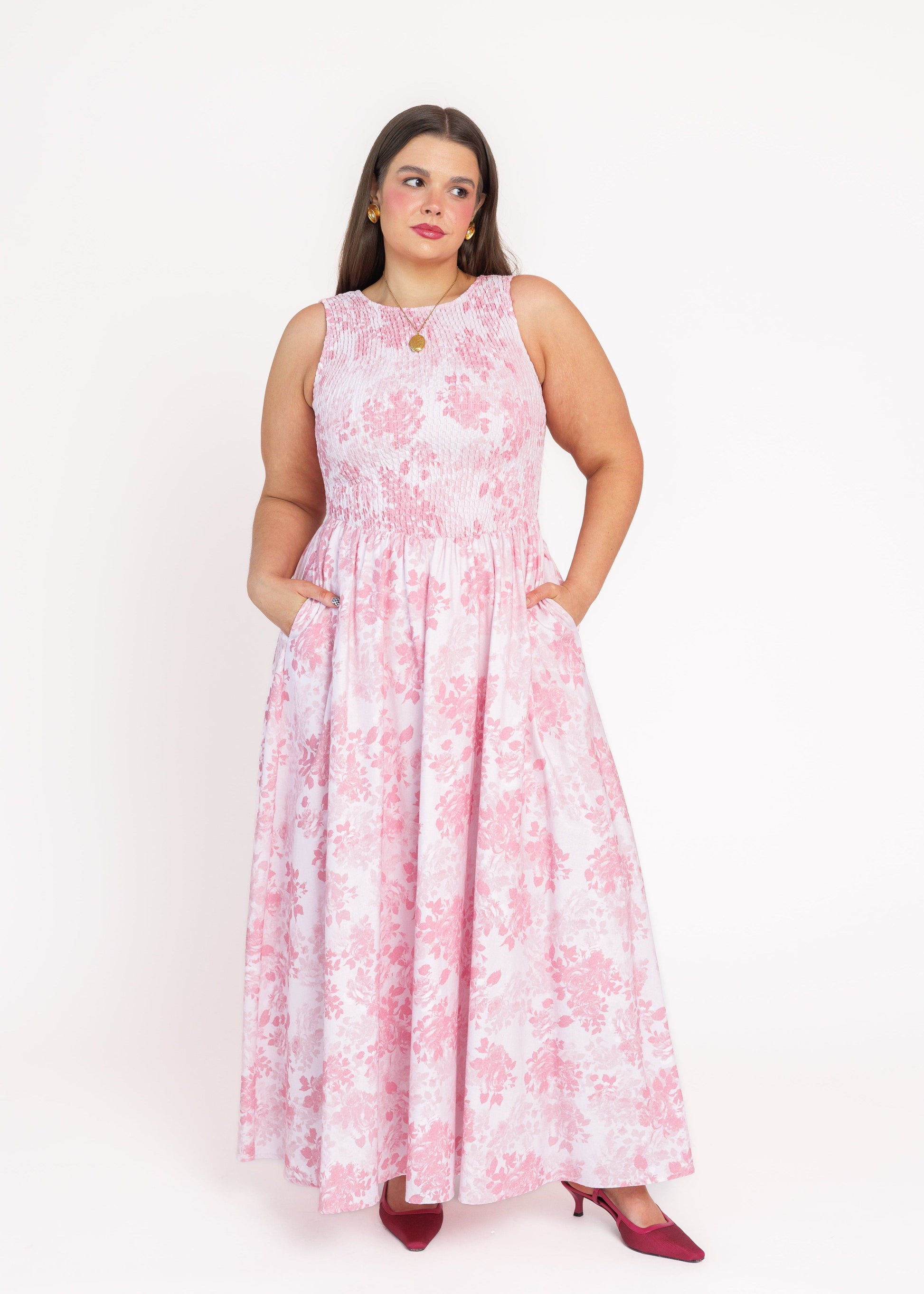 chic size inclusive model wearing JessaKae Camille Smocked Floral Maxi Dress - Pink