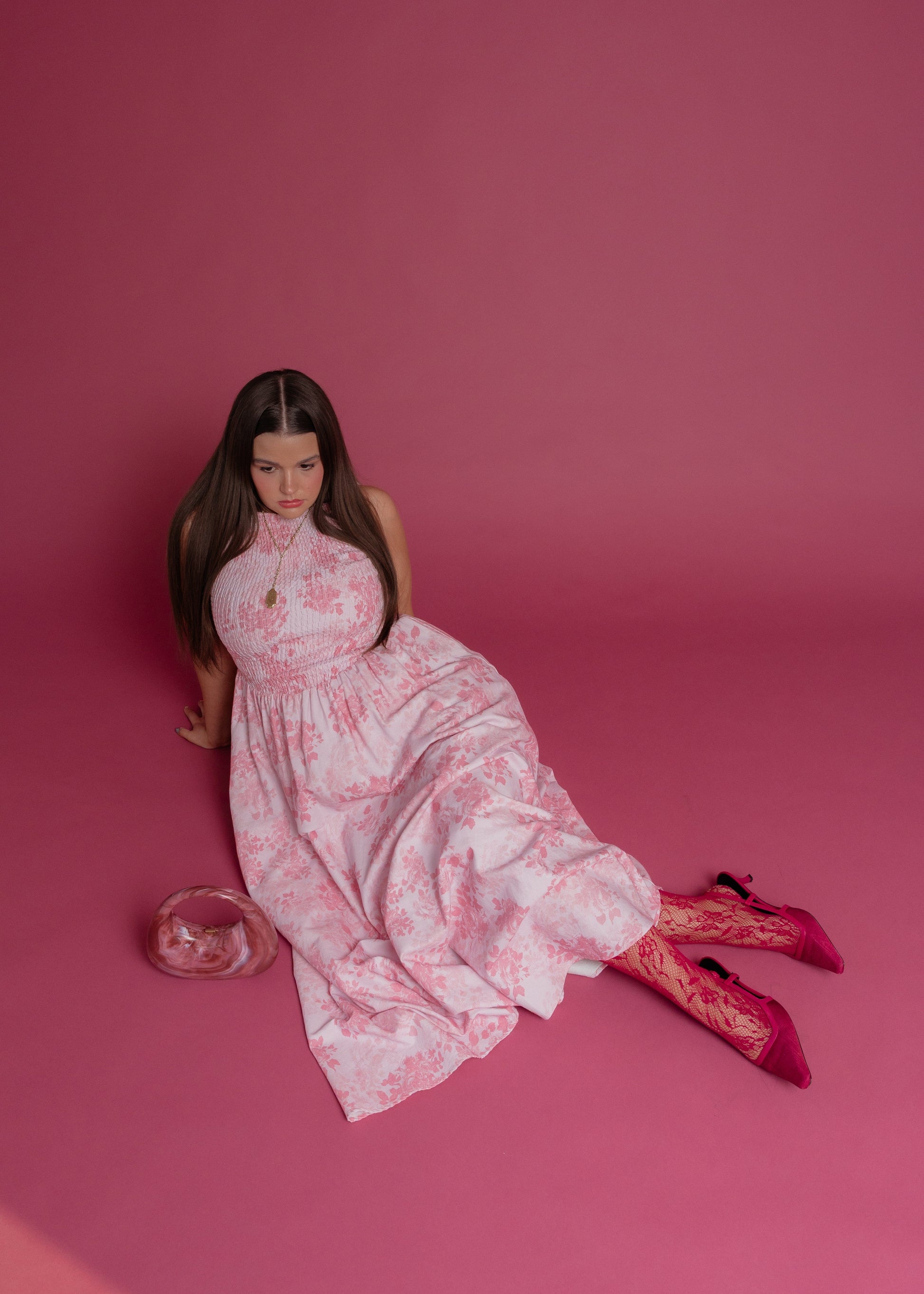 chic size inclusive model wearing JessaKae Camille Smocked Floral Maxi Dress - Pink