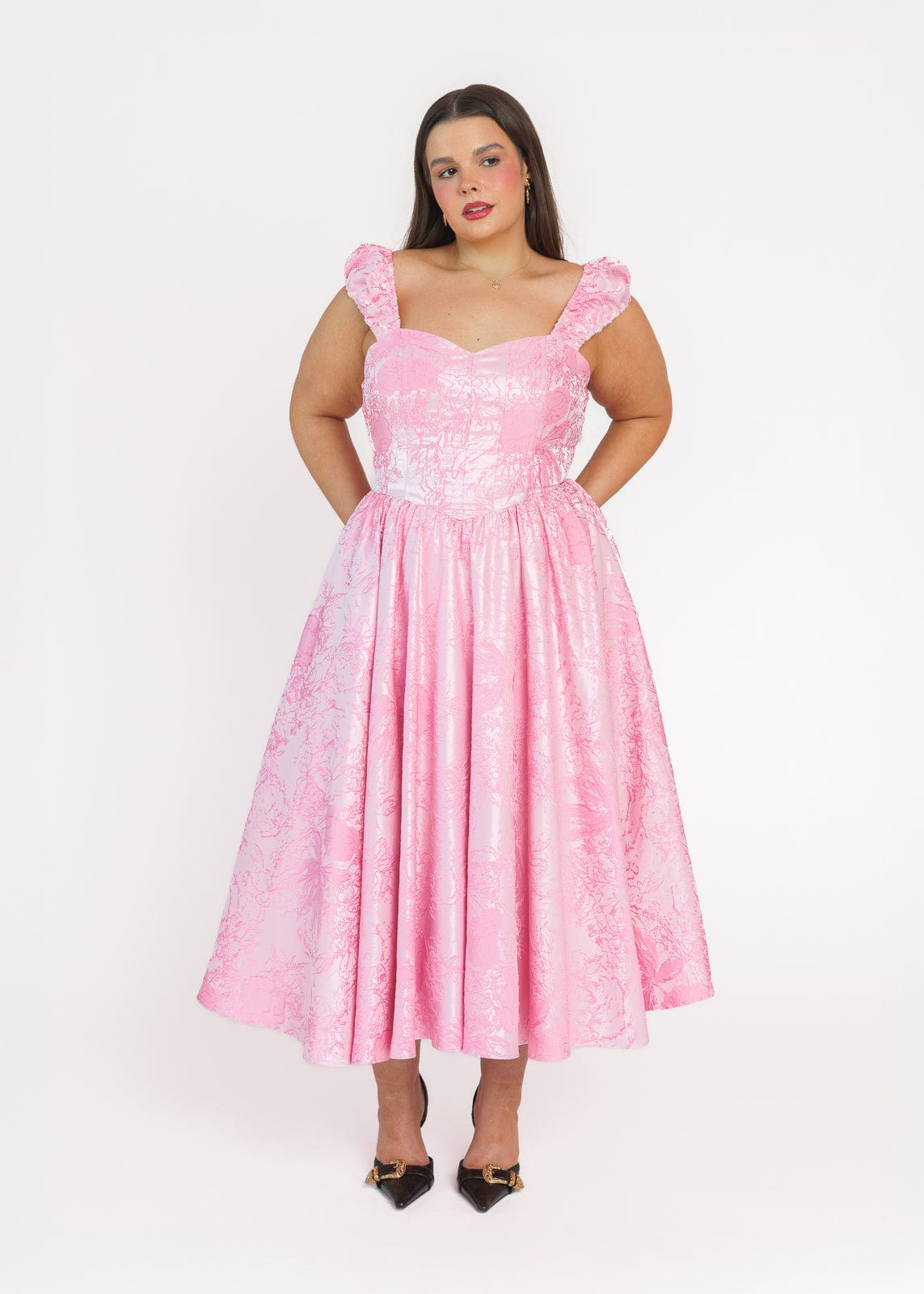 chic size inclusive model wearing JessaKae Carolyn A-Line Basque Waist Midi Dress - Pink