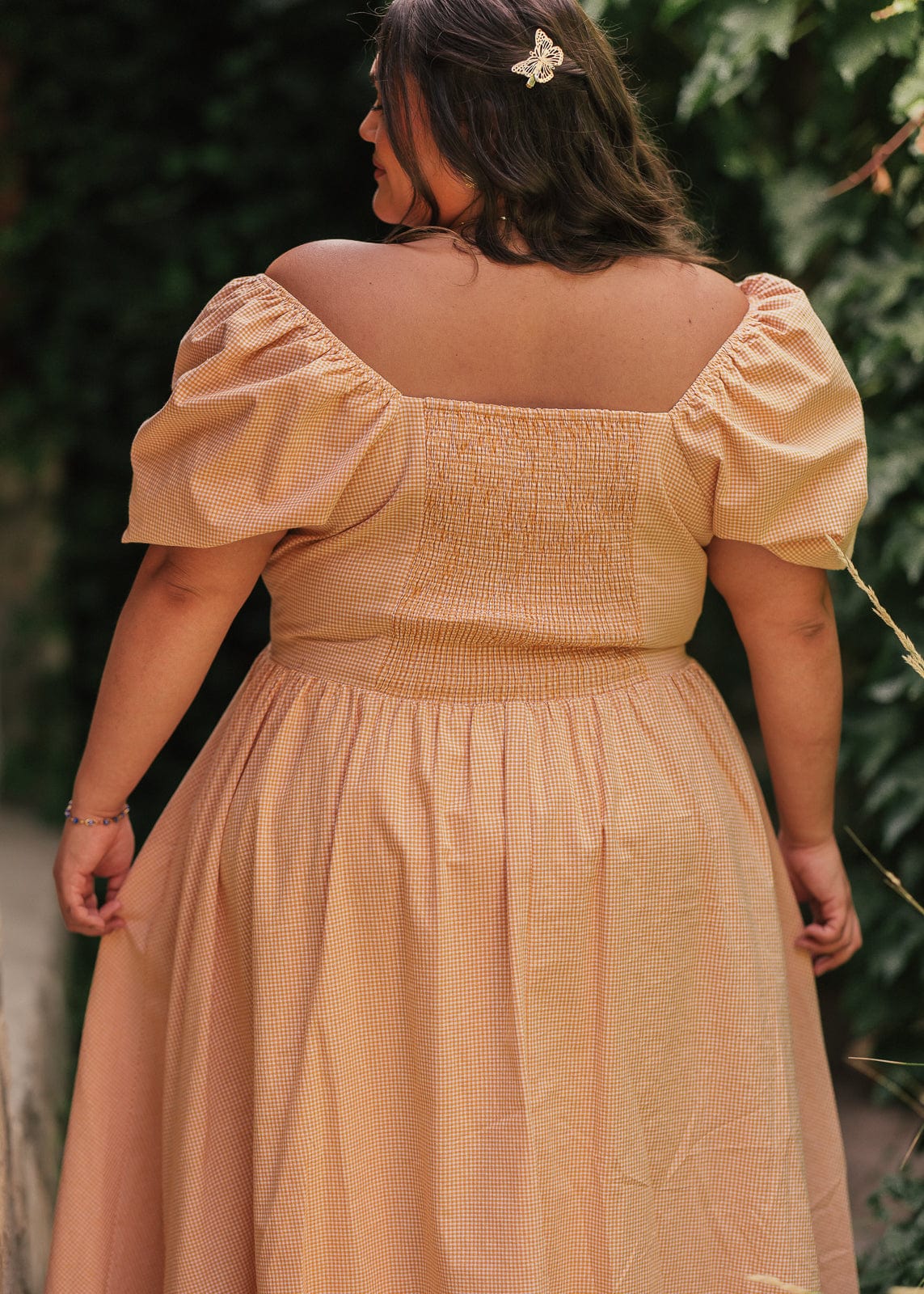 chic size inclusive model wearing JessaKae Cosette Dress