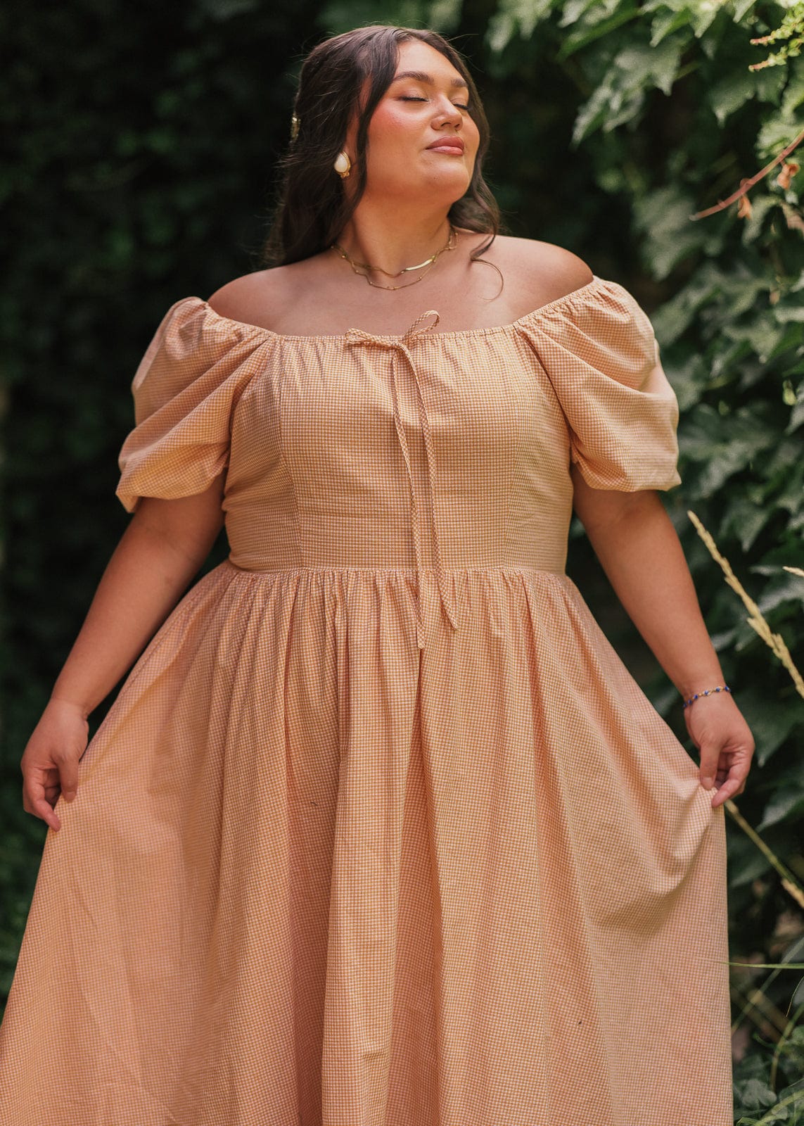 chic size inclusive model wearing JessaKae Cosette Dress