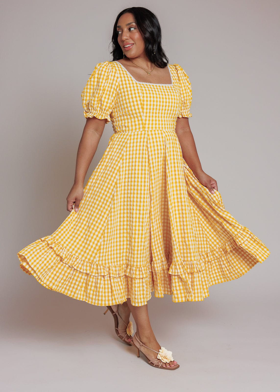 chic size inclusive model wearing JessaKae Dorothy Dress Dresses