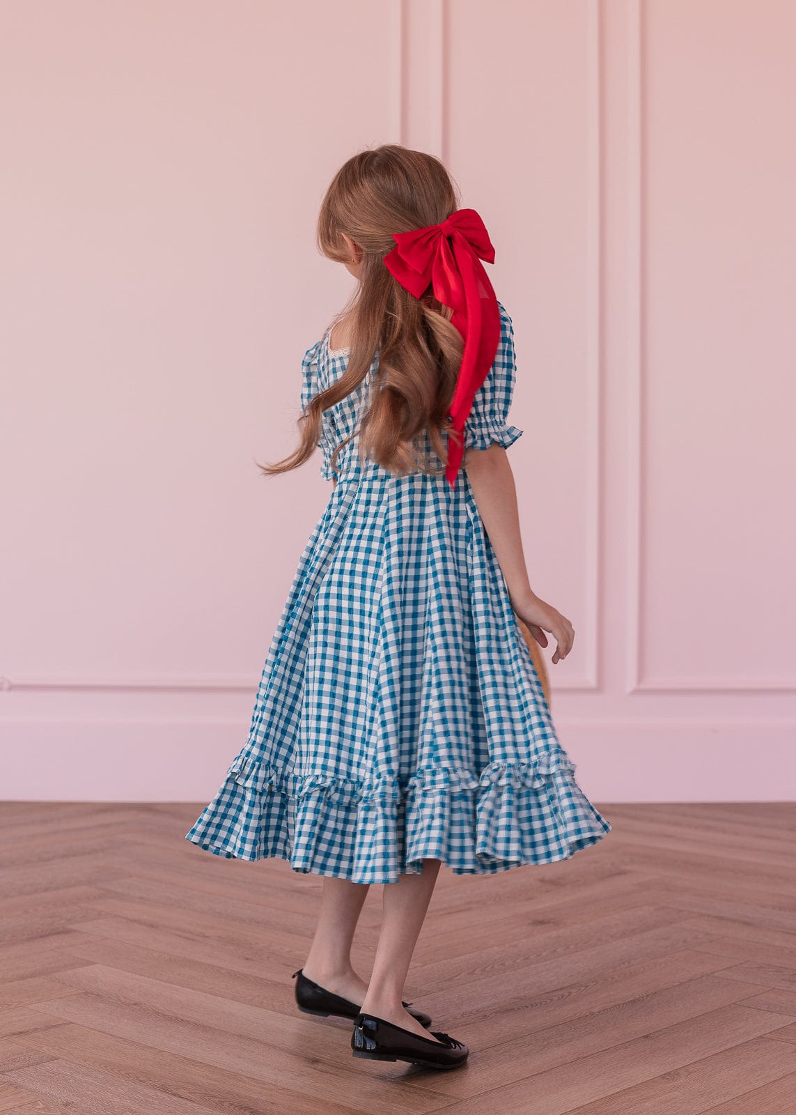chic size inclusive model wearing JessaKae Dorothy Girls Dress