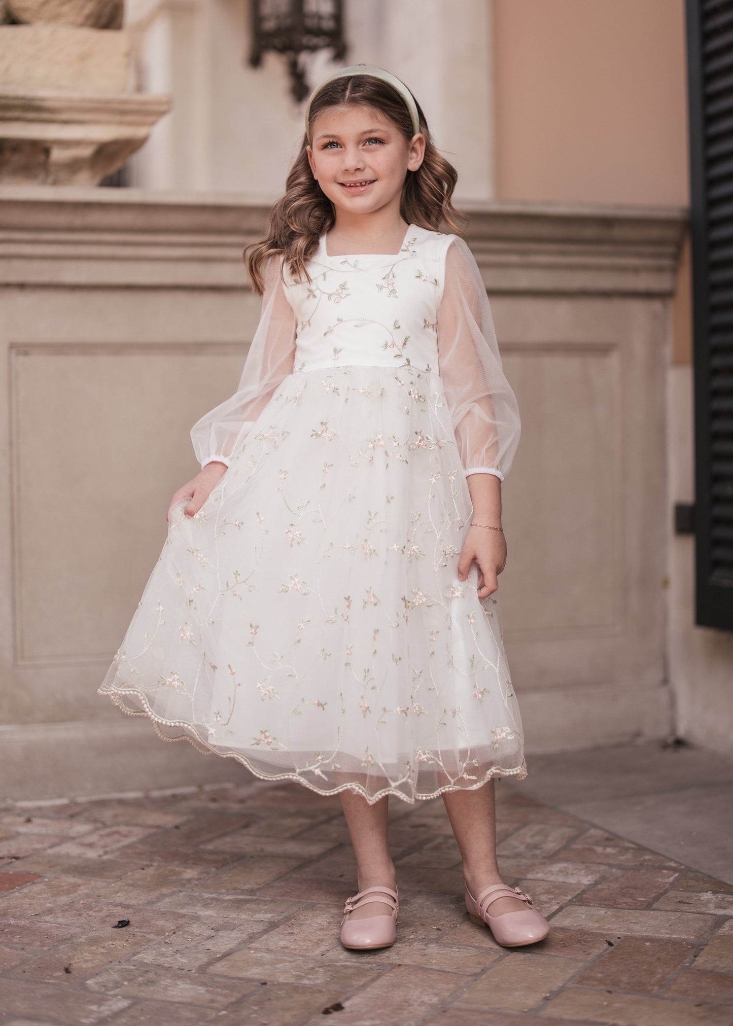 chic size inclusive model wearing JessaKae Eira Girls Dress