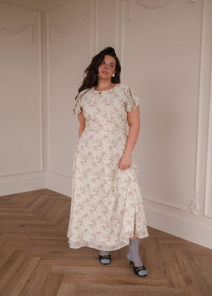 chic size inclusive model wearing JessaKae Elodie A-line Floral Midi Dress - Cream Dresses