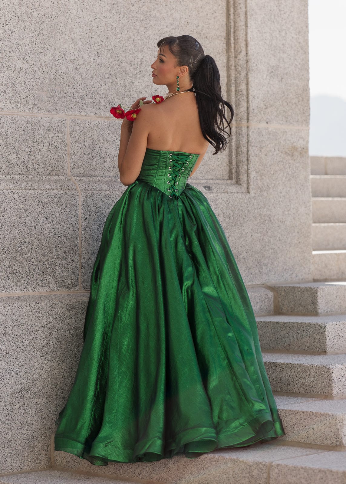 chic size inclusive model wearing JessaKae Emerald Dress