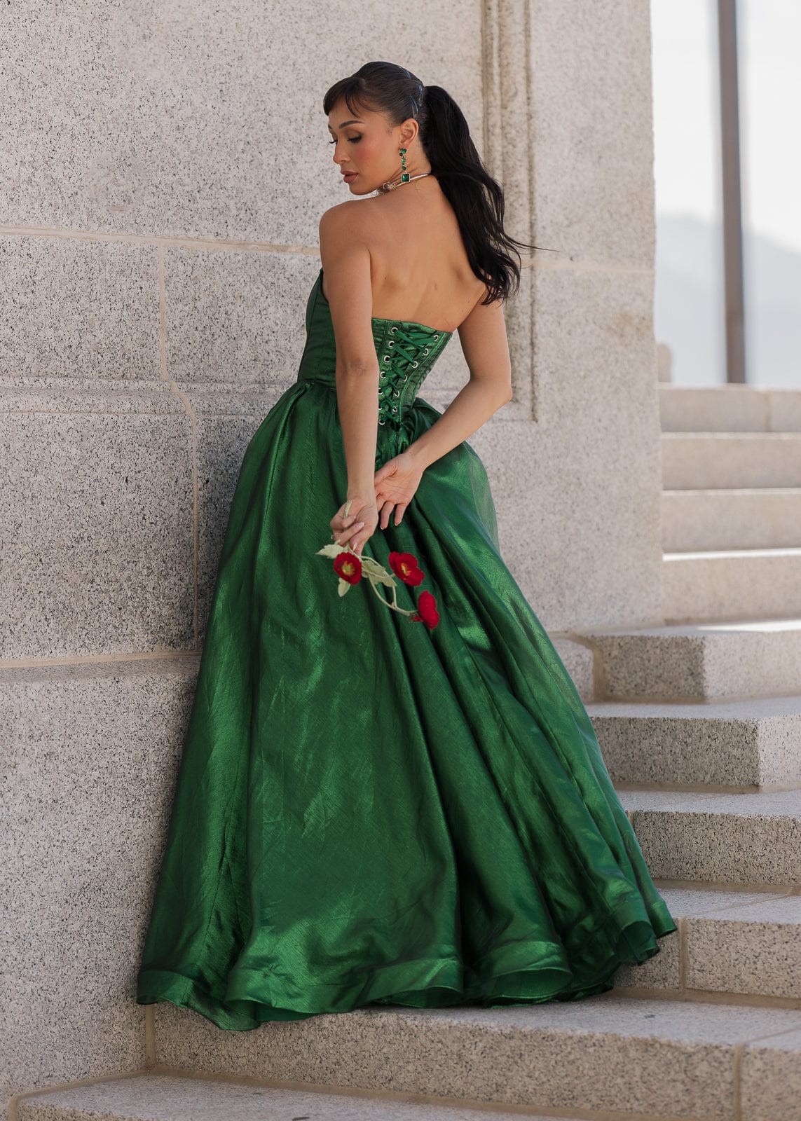 chic size inclusive model wearing JessaKae Emerald Dress