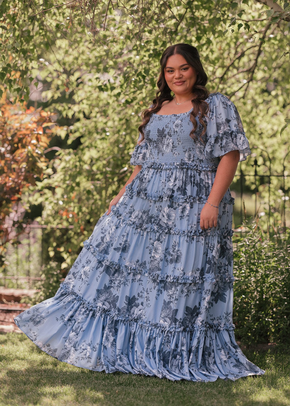 chic size inclusive model wearing JessaKae Faeryn Dress