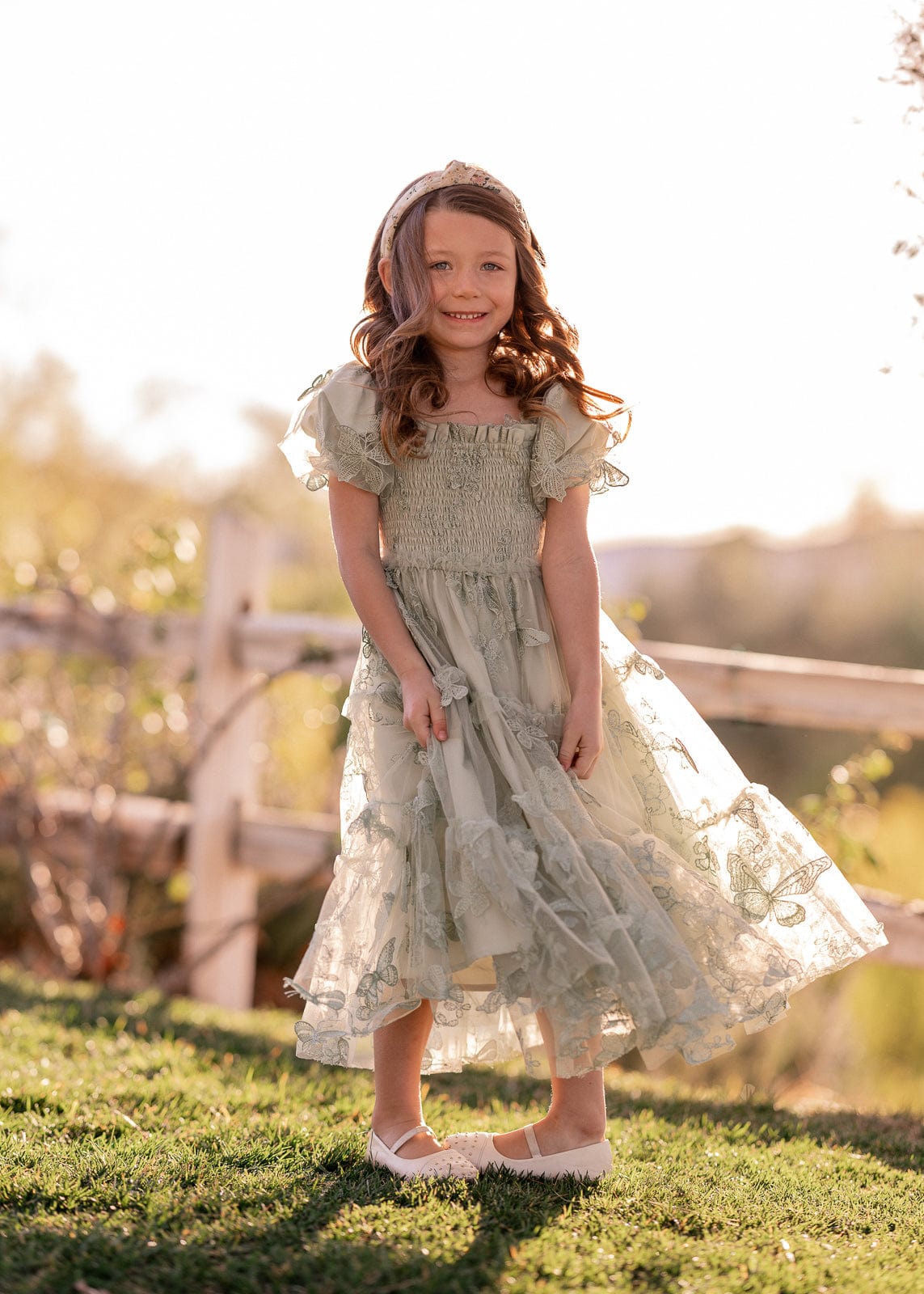 chic size inclusive model wearing JessaKae Flutter Girls Dress