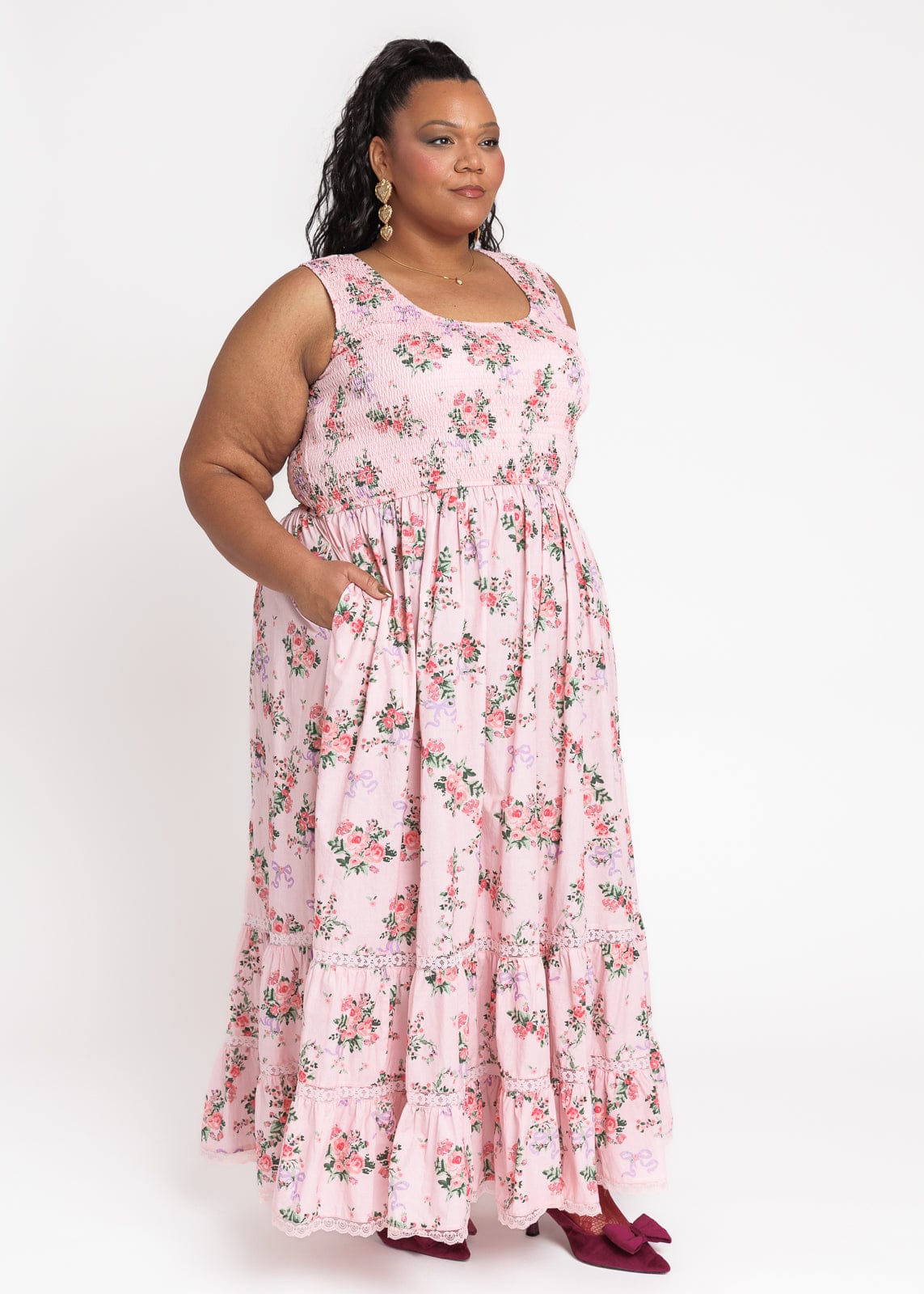 chic size inclusive model wearing JessaKae Juliette Floral Bow Print Maxi Dress - Pink