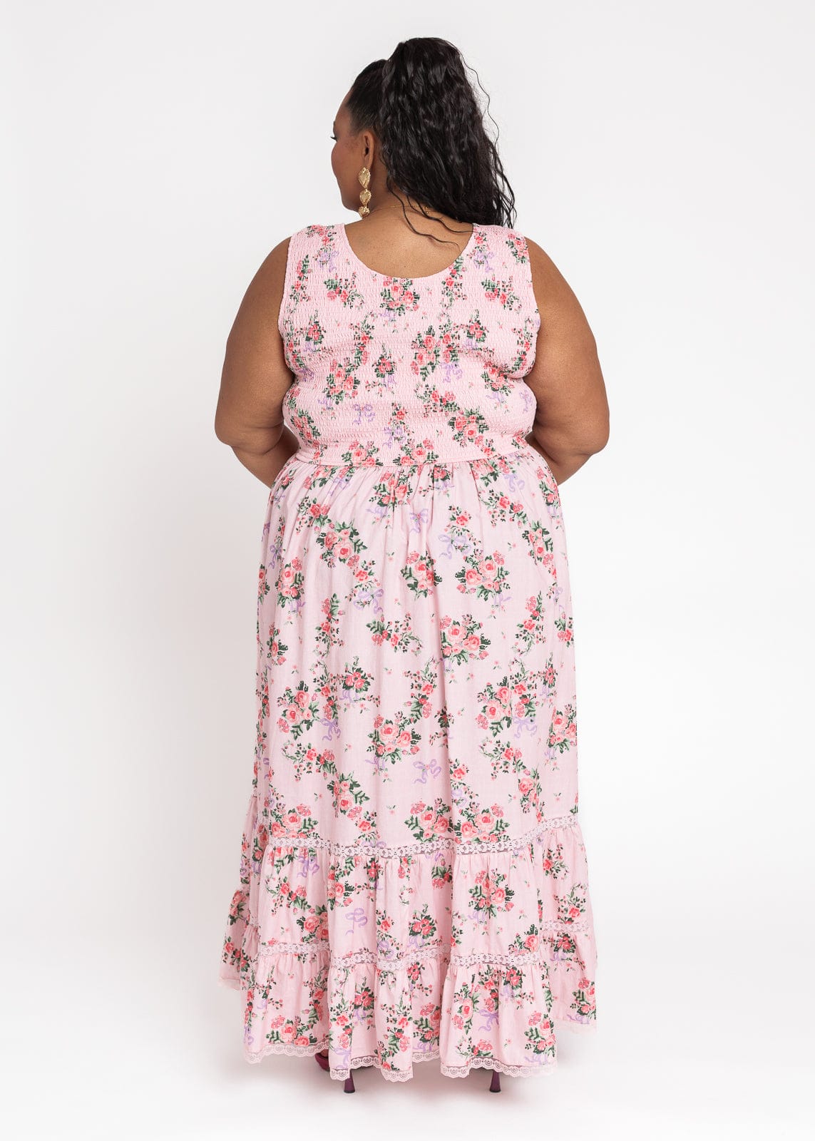 chic size inclusive model wearing JessaKae Juliette Floral Bow Print Maxi Dress - Pink