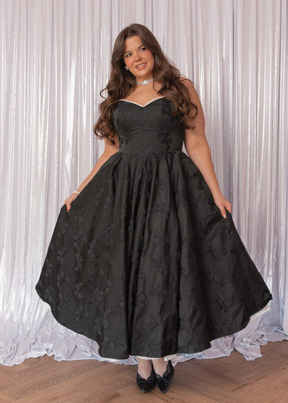 chic size inclusive model wearing JessaKae Kelly Midi Formal Dress - Black