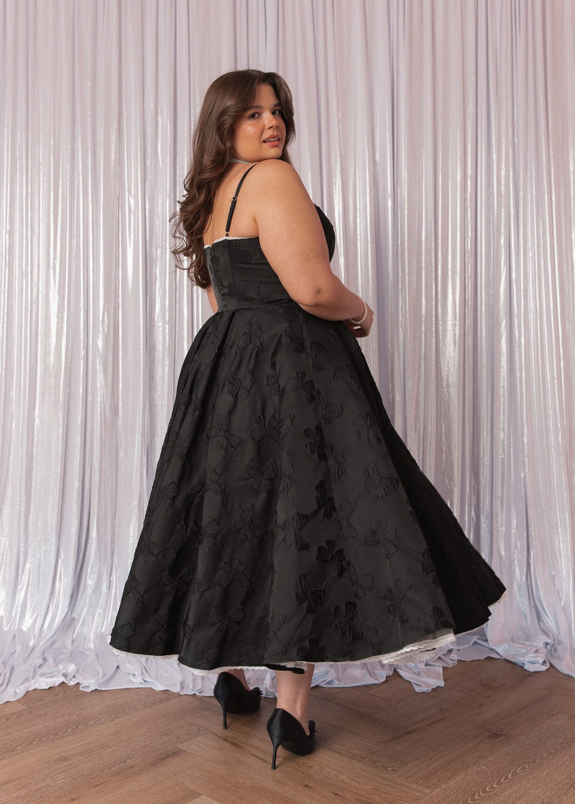 chic size inclusive model wearing JessaKae Kelly Midi Formal Dress - Black