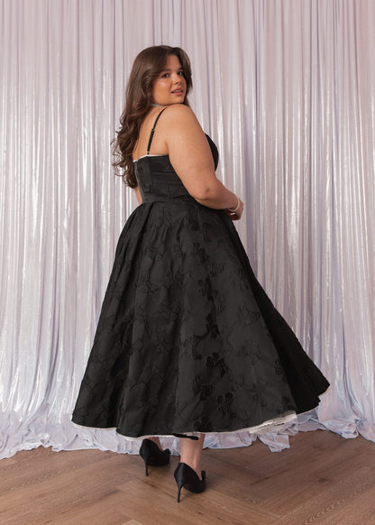 chic size inclusive model wearing JessaKae Kelly Midi Formal Dress - Black