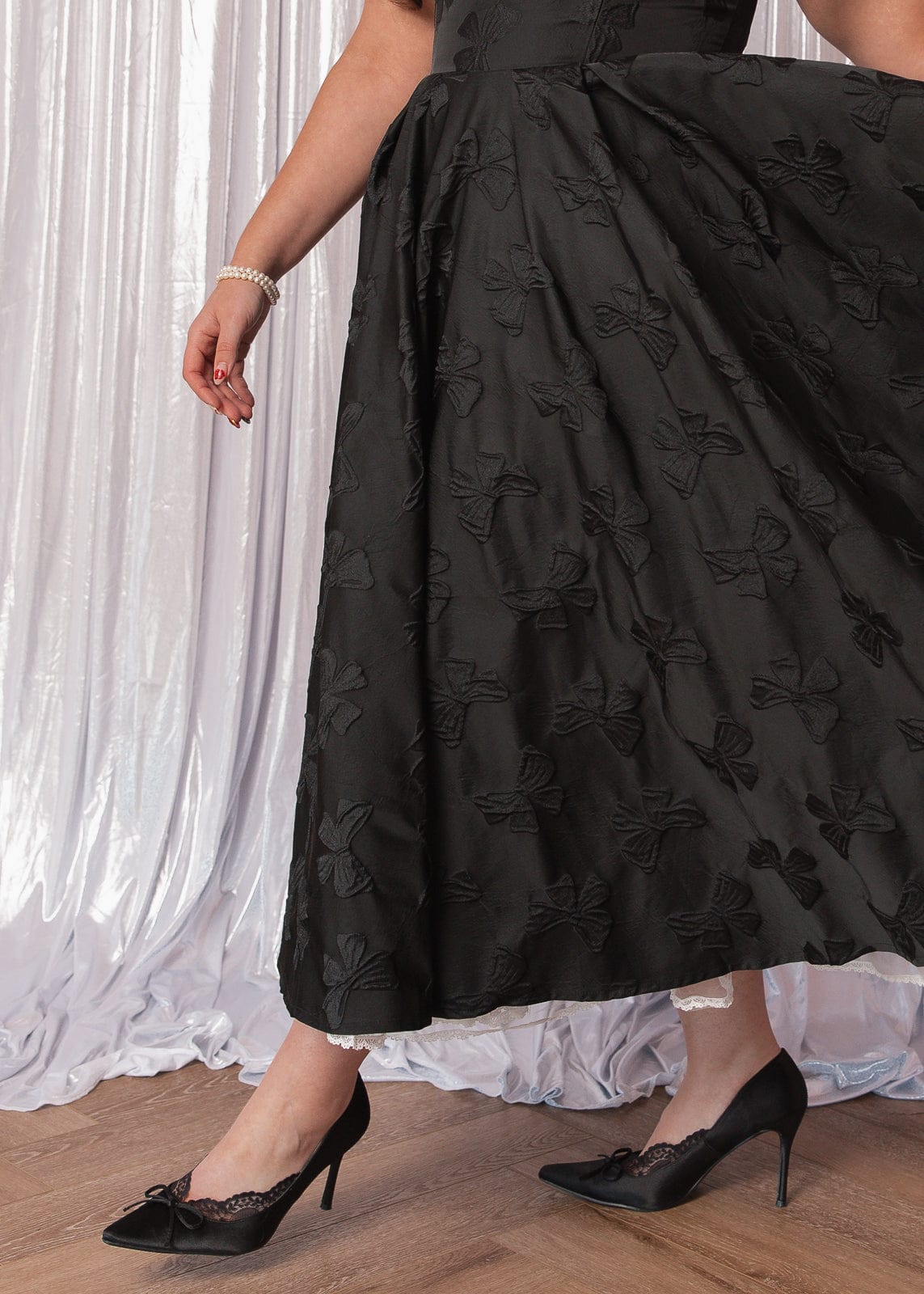 chic size inclusive model wearing JessaKae Kelly Midi Formal Dress - Black