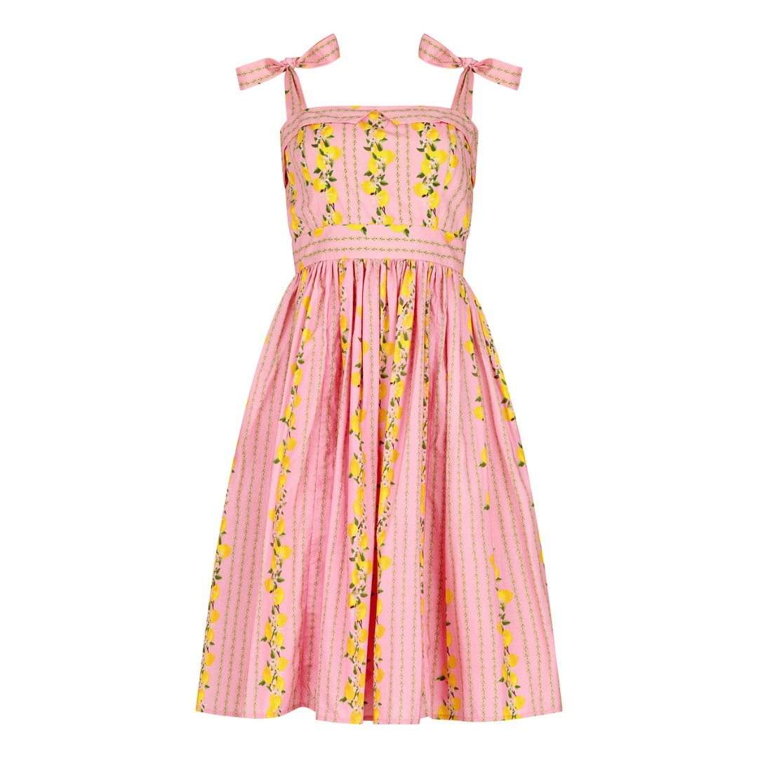 chic size inclusive model wearing JessaKae Lemon Drop Dress