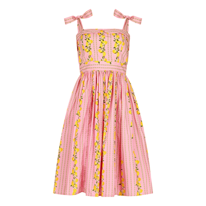 chic size inclusive model wearing JessaKae Lemon Drop Dress