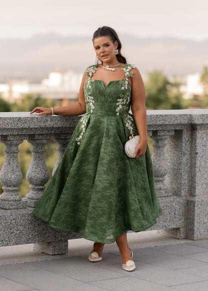 chic size inclusive model wearing JessaKae Lily Petal Dress