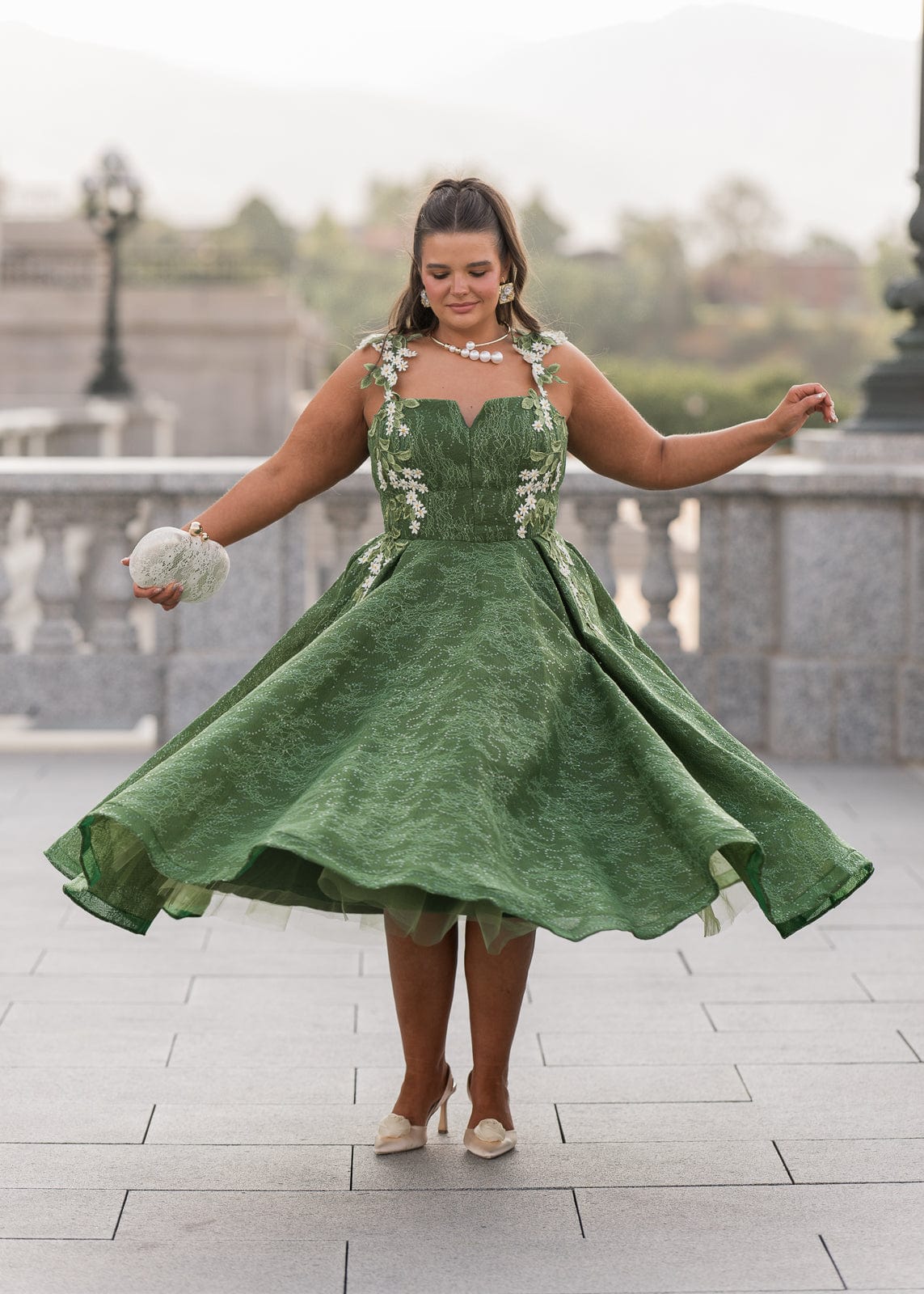 chic size inclusive model wearing JessaKae Lily Petal Dress