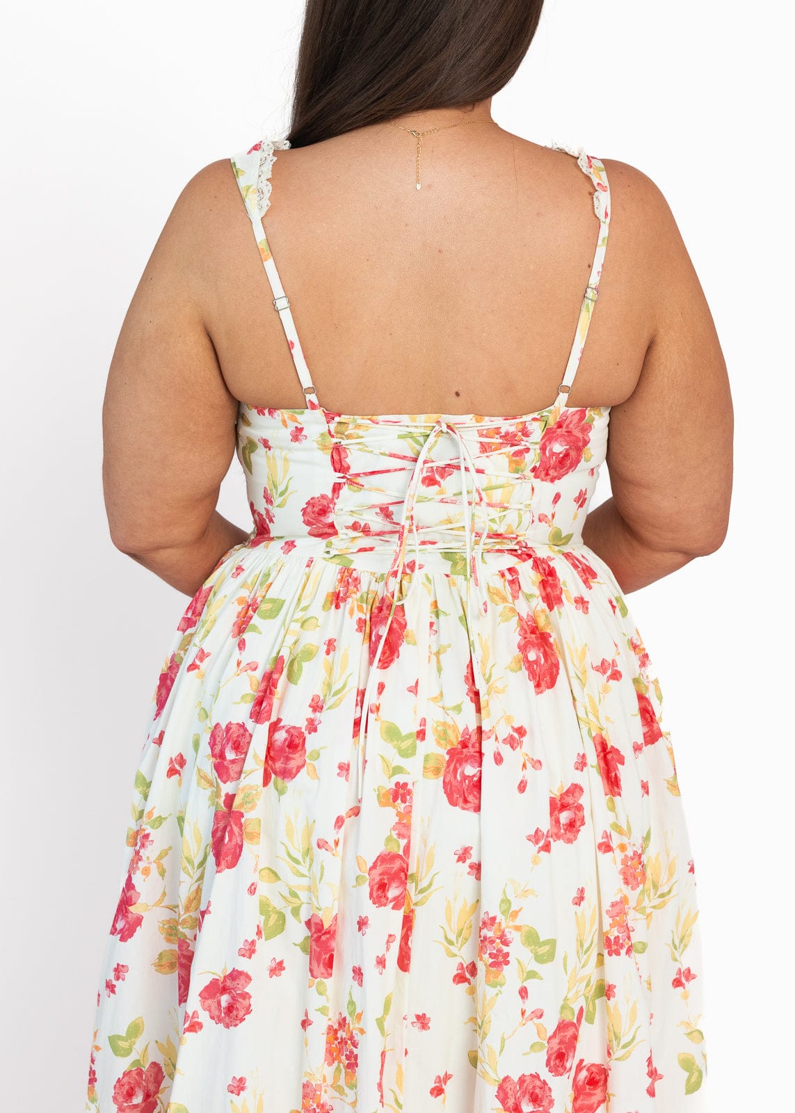 chic size inclusive model wearing JessaKae Lottie Basque Waist Floral Midi Dress - White