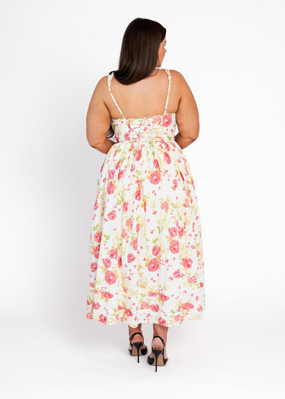 chic size inclusive model wearing JessaKae Lottie Basque Waist Floral Midi Dress - White