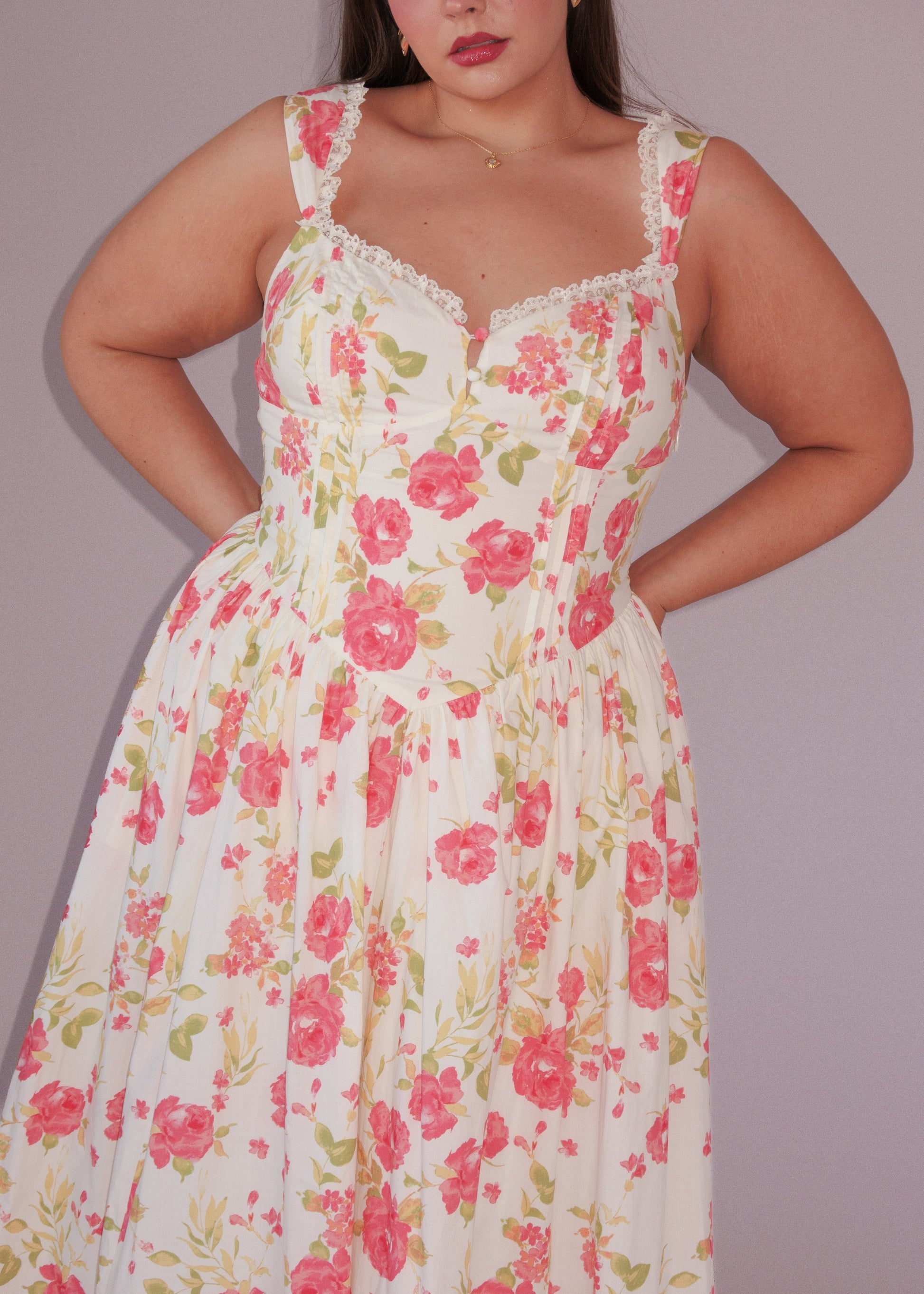 chic size inclusive model wearing JessaKae Lottie Basque Waist Floral Midi Dress - White