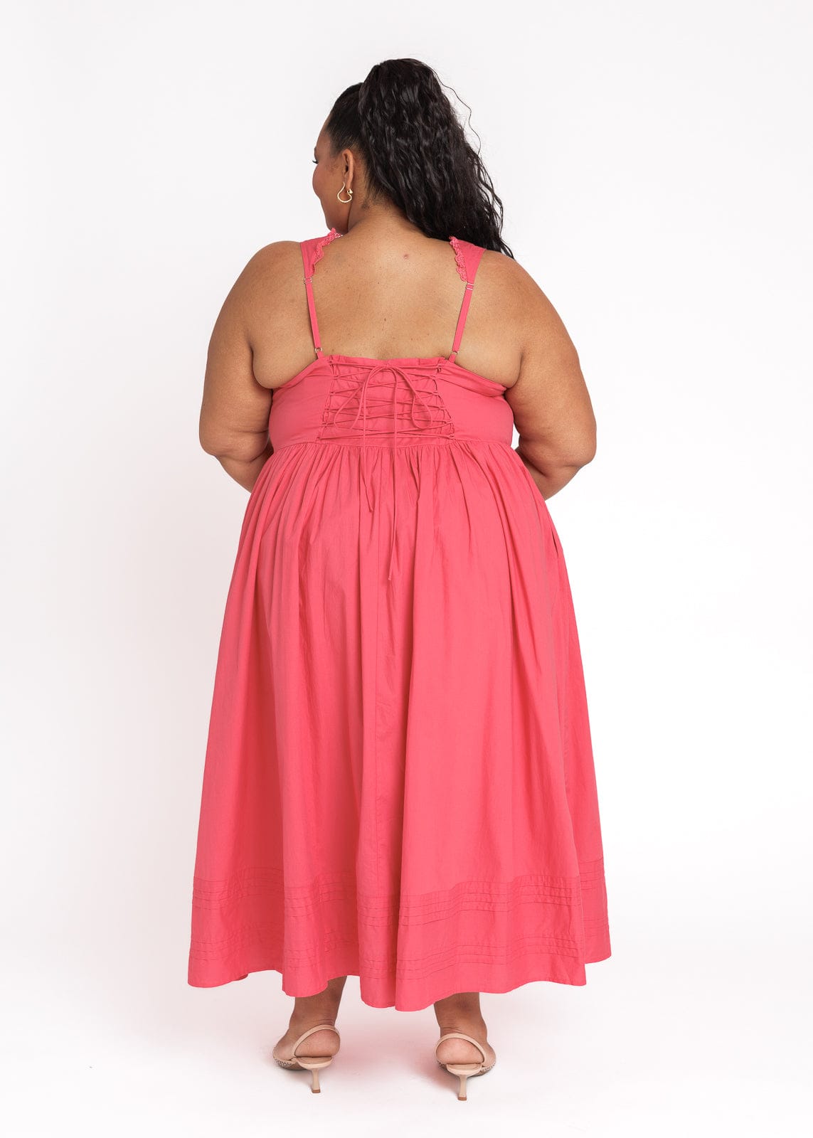 chic size inclusive model wearing JessaKae Lottie Basque Waist Midi Dress - Coral