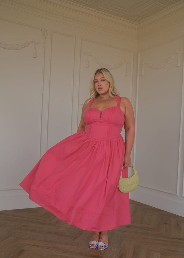 chic size inclusive model wearing JessaKae Lottie Basque Waist Midi Dress - Coral Dresses