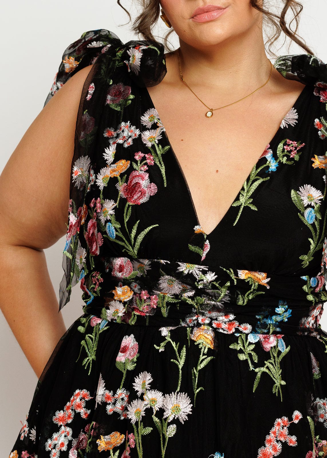 chic size inclusive model wearing JessaKae Margaret Floral Embroidered Midi Dress Black Dresses