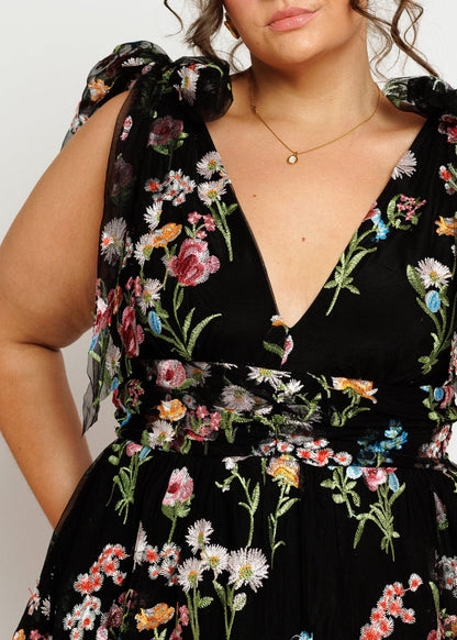 chic size inclusive model wearing JessaKae Margaret Floral Embroidered Midi Dress Black Dresses