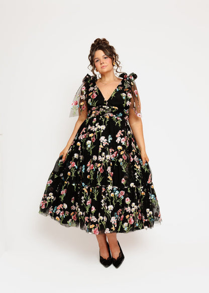 chic size inclusive model wearing JessaKae Margaret Floral Embroidered Midi Dress Black Dresses