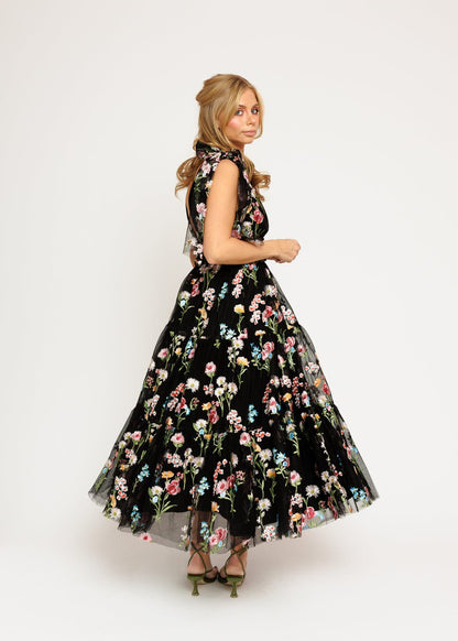 chic size inclusive model wearing JessaKae Margaret Floral Embroidered Midi Dress Black Dresses