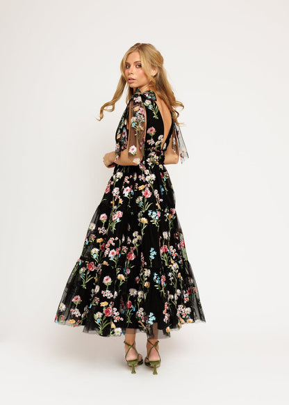 chic size inclusive model wearing JessaKae Margaret Floral Embroidered Midi Dress Black Dresses