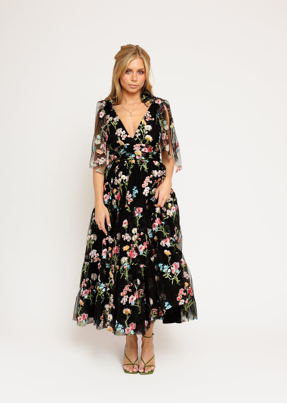 chic size inclusive model wearing JessaKae Margaret Floral Embroidered Midi Dress Black Dresses