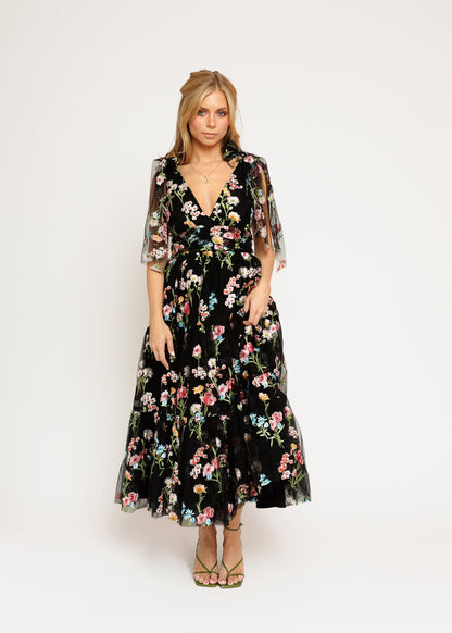 chic size inclusive model wearing JessaKae Margaret Floral Embroidered Midi Dress Black Dresses