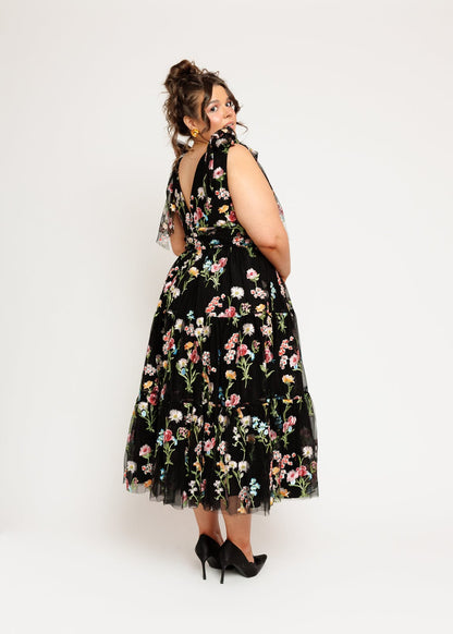 chic size inclusive model wearing JessaKae Margaret Floral Embroidered Midi Dress Black Dresses