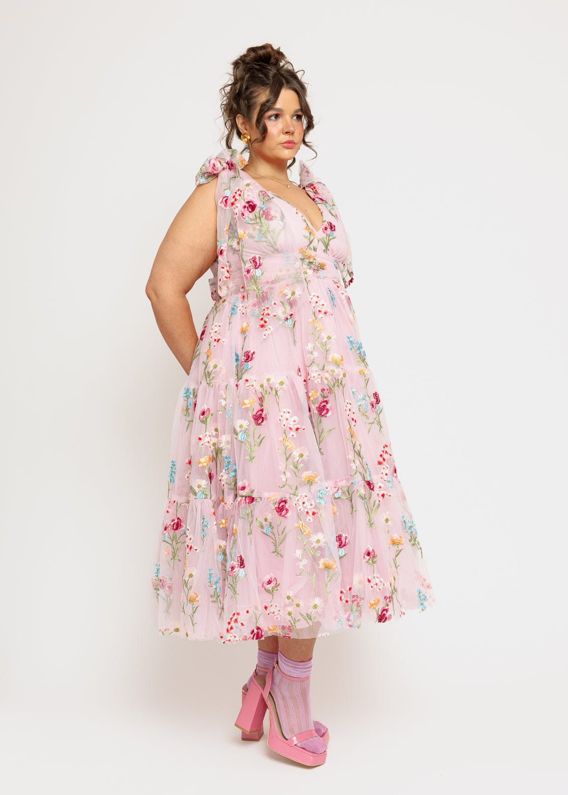 chic size inclusive model wearing JessaKae Margaret Floral Embroidered Midi Dress Pink Dresses