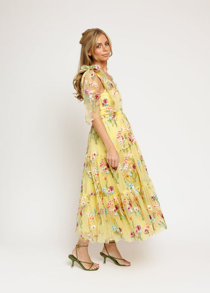 chic size inclusive model wearing JessaKae Margaret Floral Embroidered Midi Dress Yellow Dresses
